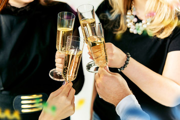 Celebration. Hands holding the glasses of champagne and wine making a toast. The party, celebration, alcohol, lifestyle, friendship, holiday, christmas, new, year and clinking concept