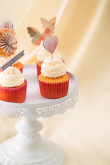 Tasty sweet pink cupcakes. Decorated dessert table