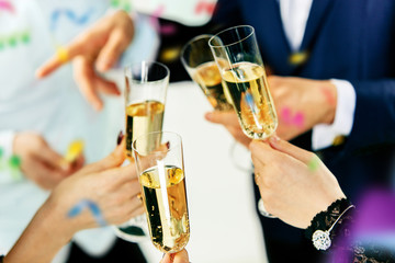 Celebration. Hands holding the glasses of champagne and wine making a toast. The party, alcohol,...