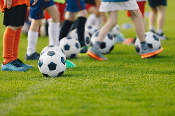 Football practice for youth. Children soccer training background. Group of young boys training...