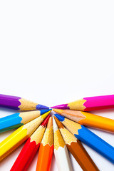 Naklejka premium colored pencils on white background