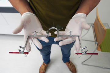 facial arc for articulator in the hands of Dental Orthodontist