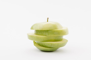 sliced golden delicious apple on white background