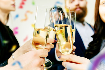 Celebration. Hands holding the glasses of champagne and wine making a toast. The party, alcohol,...