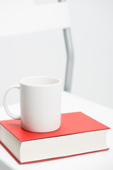 A mug on a book