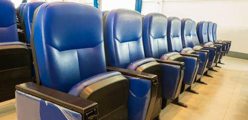 Row Chair Blue at cinema theater in the afternoon is sunset light