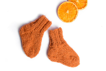 Rough and warm sheep wool socks, handmade for newborn baby, chunky, brown color, white isolated