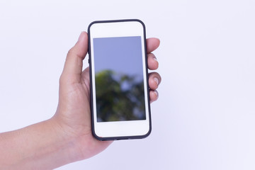 Young girl is using phone with white background,Phone is in hands of woman.