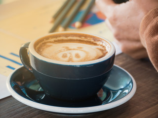 Hot coffee vintage image on blurred pencil background,