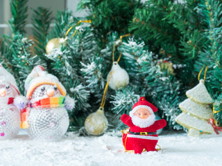 Christmas decorative gift boxes, drums and balls isolated on white background, santa claus small toy on white snow,