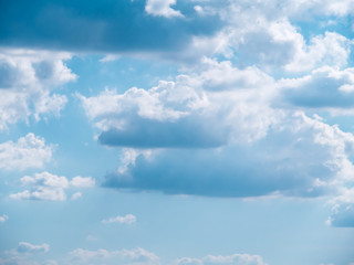 Light in the clouds on blue sky, The stormy and fluffy clouds shined from above with the sunlight, view from airplane Windows.