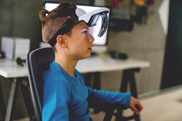 Teenage boy with AR glasses