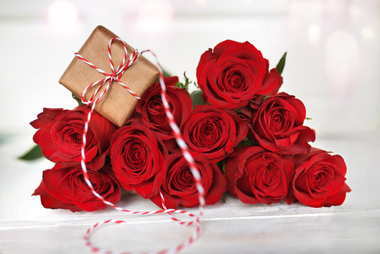 Red roses with a gift