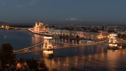 Panorama of the Hungarian Parliament, and the Chain bridge (Szechenyi Lanchid), over the River Danube, Budapest, Hungary, at night