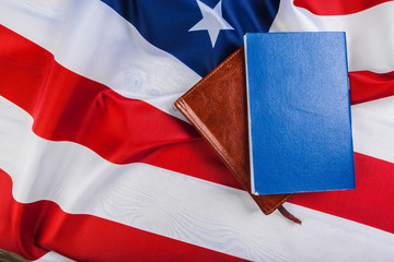Bible laying on top of an american flag