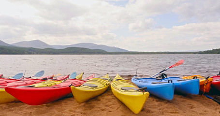 Scottish landscapes: kayaks on the shore of Loch Morlich at Cairngorms National Park, Highlands, Scotland, UK