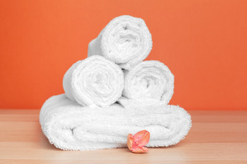 Obraz na płótnie Canvas Clean soft towels on color background