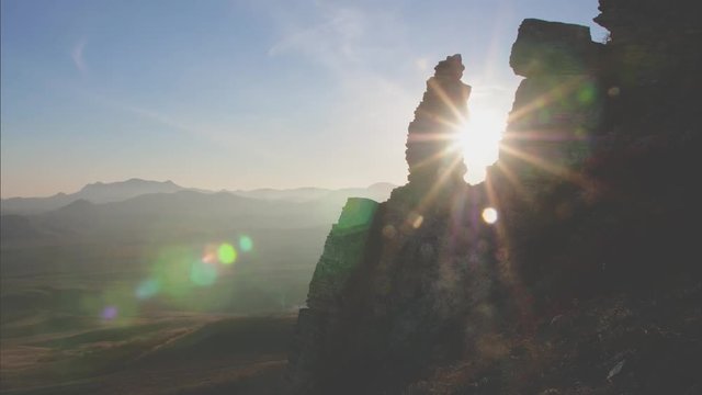 time lapse sunset in the mountains the sun moves from one rock to another