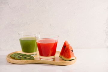 Kiwi juice and watermelon with fruit Slices on wooden tray