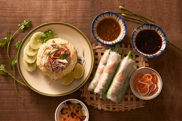 Assorted asian dinner, vietnamese food. Chicken rice, spring rolls