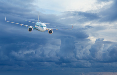 Passenger airplane in the clouds - Travel by air transport
