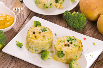 Potato gratins with broccoli florets.