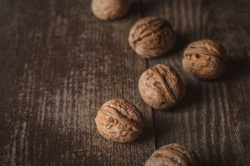 close up view of walnuts on wooden surface
