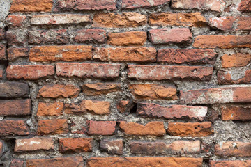 Old orange brick wall, close up.