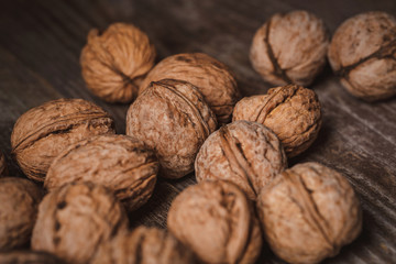 close up view of walnuts on wooden tabletop