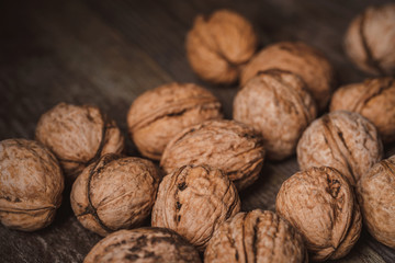 close up view of walnuts on wooden tabletop