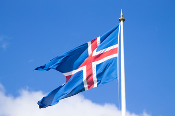 Iceland flag that waves over blue sky