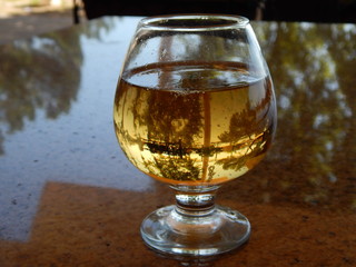 glass of whiskey on wooden table