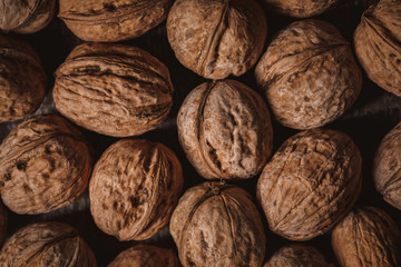 full frame of walnuts arranged as backdrop