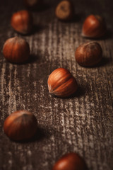 close up view of shelled hazelnuts on wooden tabletop