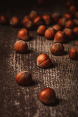 close up view of shelled hazelnuts on wooden tabletop