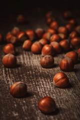 close up view of shelled hazelnuts on wooden tabletop