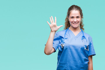 Young brunette doctor girl wearing nurse or surgeon uniform over isolated background showing and...