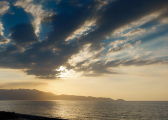 Sea and cliff during sunset