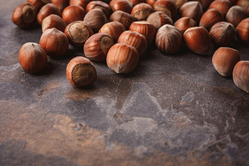 close up view of shelled hazelnuts on grey tabletop