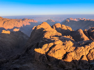 Fototapeta na wymiar Spectacular aerial view of the holy summit of Mount Sinai, Aka Jebel Musa, 2285 meters, at sunrise, Sinai Peninsula in Egypt. Spirituality, religion and history concept.
