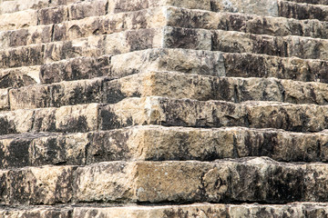 Pyramidal structure made of stones. Stepped structure made of stone blocks. Stone stairs. Pyramid close up.