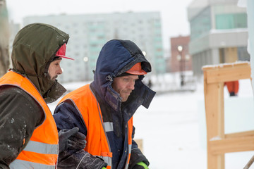 Installers at the construction of the ice town