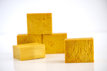 Natural handmade yellow soap bars isolated on white
