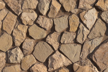 Natural stone laid out on a plane and fixed to glue with cement