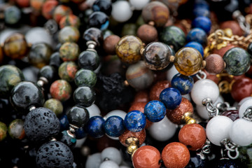Background pattern of multicolored natural stone beads.