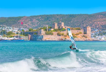 Wandaufkleber Saint Peter Castle (Bodrum castle) and marina in Bodrum, Turkey - Beautiful cloudy sky with Windsurfer Surfing The Wind On Waves © muratart