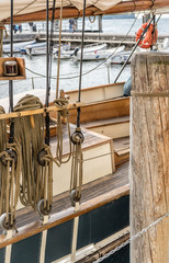 Detail of an old sailboat anchoring in the harbor
