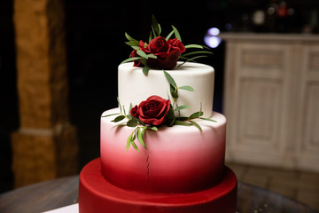 Delicious wedding cake decorated with flowers