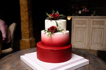 Delicious wedding cake decorated with flowers