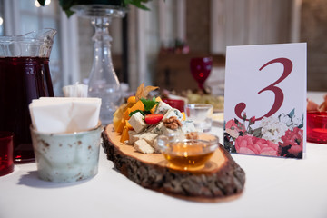 Plate with cheese on the table in restaurant